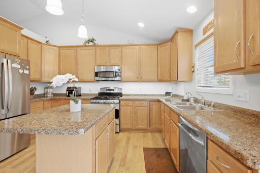 Light-filled kitchen with stainless steel appliances and new disposal installed in 2026.