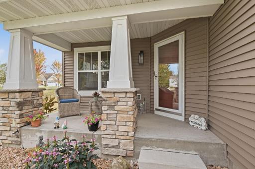 Gorgeous landscaping and concrete front porch.