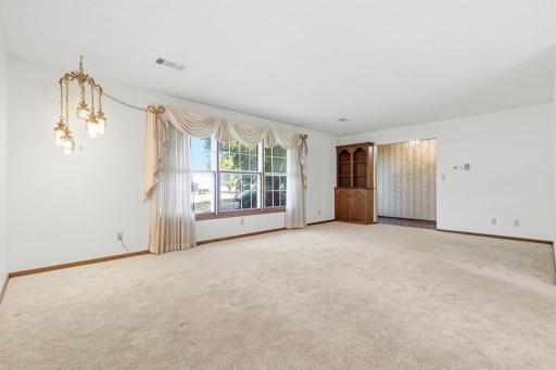 Front living room with large front window offering natural light to brighten the space