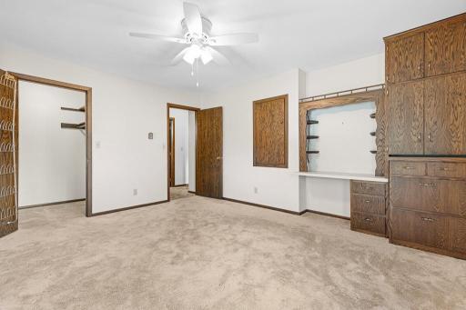Walk-in closet and built-in desk and shelving