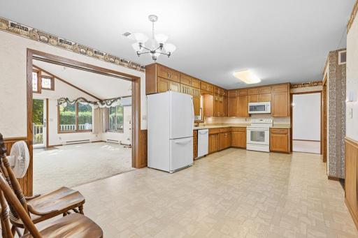 Kitchen opens up to the sun room