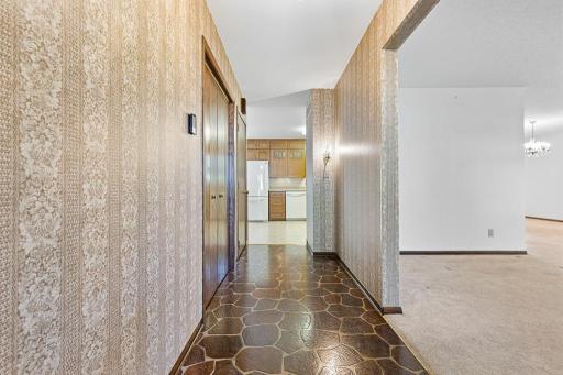 Looking from the front door straight to the kitchen, and to the right is a large open living and dining room