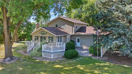 The backyard is nothing short of incredible with a deck overlooking the peaceful yard and patio for relaxing or grilling.