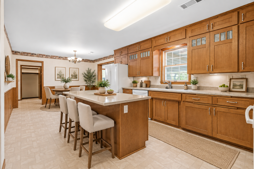 *Virtually staged* to showcase what it would be like with a small island added to the kitchen to add some casual dining and additional prep space