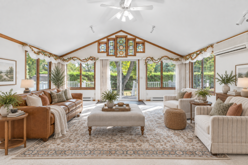 Virtually staged heart of the home - a cozy but bright sunroom to bask in the natural sunlight