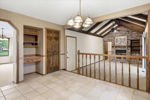 Spacious informal dining area opens to the great room and includes a built-in desk area and additional cabinetry for convenient storage.