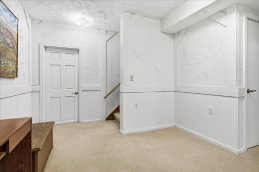Additional open space near the stairs offers even more flexibility for a desk, hobby area, or extra storage.