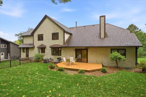 Deck located just off the home provides a convenient space for outdoor dining, grilling, and relaxing while overlooking the backyard.