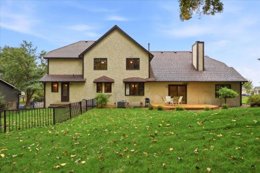 Spacious backyard with mature trees and plenty of green space, offering a private setting for outdoor enjoyment.