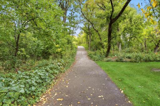 Enjoy direct access from the backyard to the neighborhood trail system, offering a convenient way to walk, bike, and enjoy the beautiful wooded surroundings.