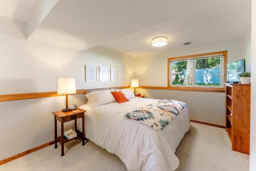 Primary bedroom is in lower level with large look out windows.