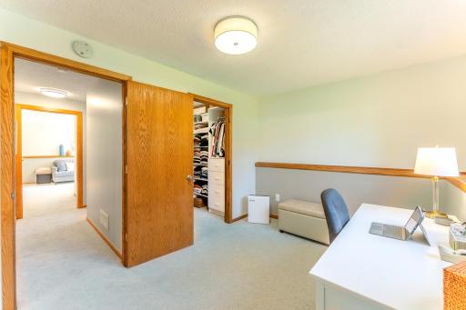 Primary bedroom has space for home office or private sitting area and a walk in closet.