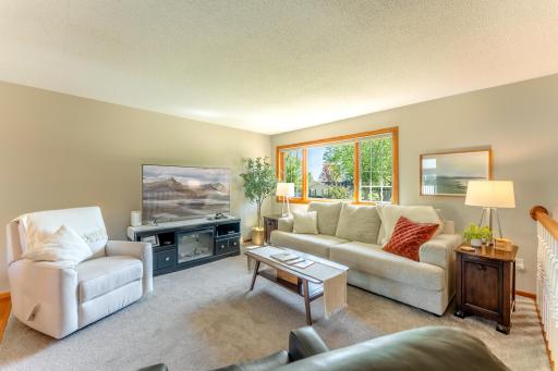 Living room's large window let in plenty of natural light.