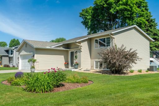 Summer photo shows the beautiful landscaping.