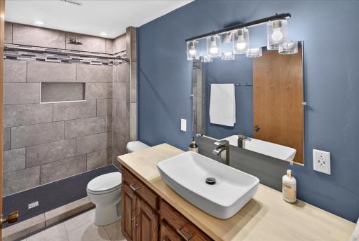 updated lower level bath with beautiful walk in shower