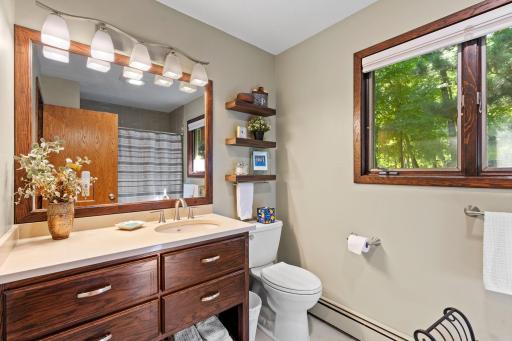 Main-level bath with a wide vanity and natural light.