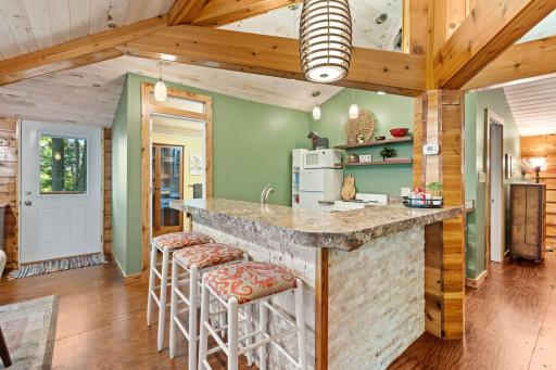 The Guest Suite kitchen opens to the living and dining areas.