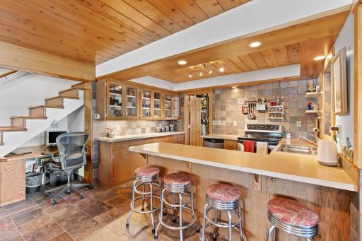 Counter seating makes the lower-level kitchen a natural gathering spot.