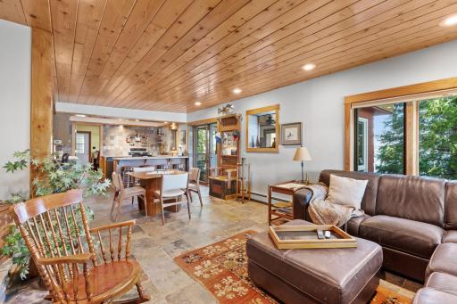 An open layout connects the lower-level kitchen, dining area, and family room.