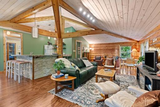 The Guest Suite above the garage feels open and welcoming with its vaulted wood ceiling.