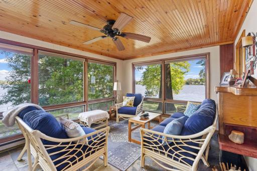 The window-filled sunroom is an easy place to slow down and enjoy the view.