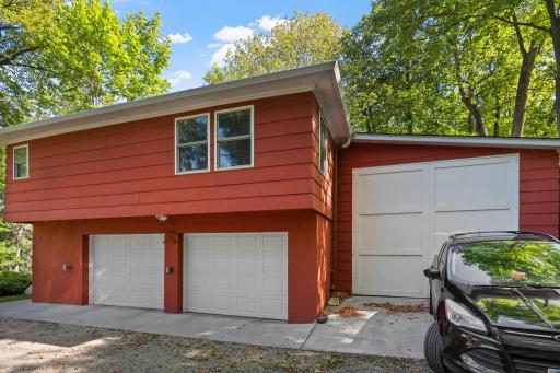 The detached garage provides plenty of parking and storage, with a full apartment above.