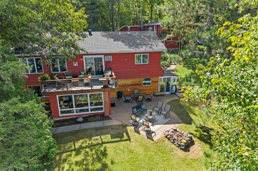 This home sits just steps from the water, with a lakeside patio and level lawn