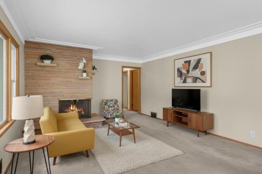 This spacious, sun-filled room provides so many options for furniture layout. (Virtually staged)