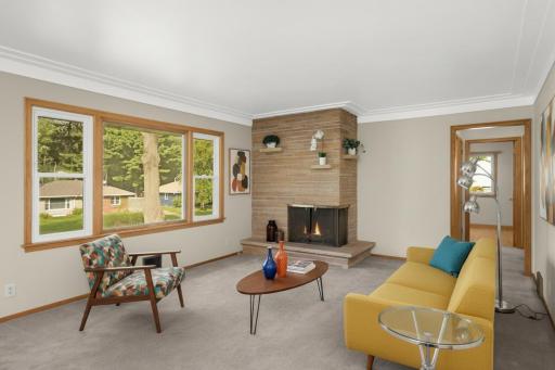 The mid-century-vibed fireplaces are truly beautiful. (virtal staging)