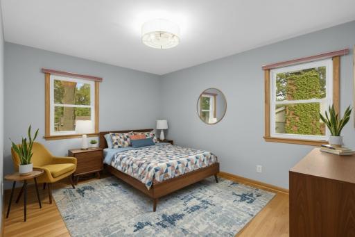 Enjoy three bedrooms on the main floor, all featuring beautiful hardwood floors (virtually staged)