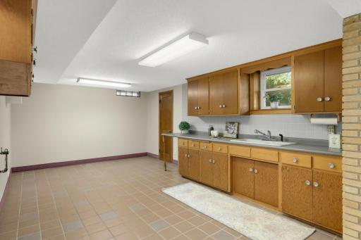 The lower-level kitchenette is spacious and bright