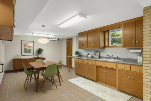 The lower-level kitchenette has so much possibility. (Virtually staged)