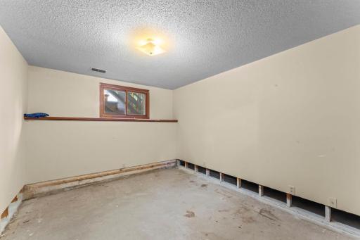 Lower level bedroom. Lower level had water intrusion and was cleaned and sheetrock cut. Home was not repaired