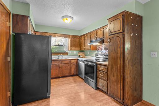 Kitchen has lots of storage and a walk-in pantry.