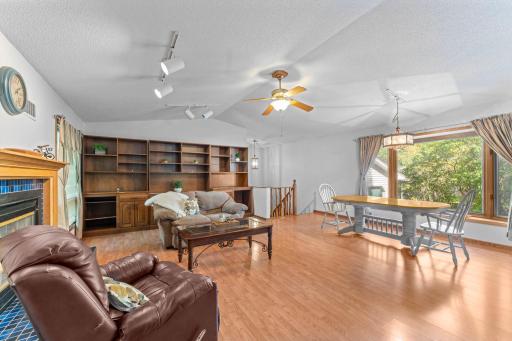 Family room has built in cabinets and large dining area with picture window