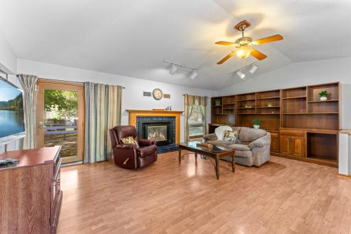 Wood burning fireplace (condition unknown). Patio door leading to side of home with deck