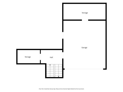 Garage with back storage. Also entry into the house from garage and additional storage on that level