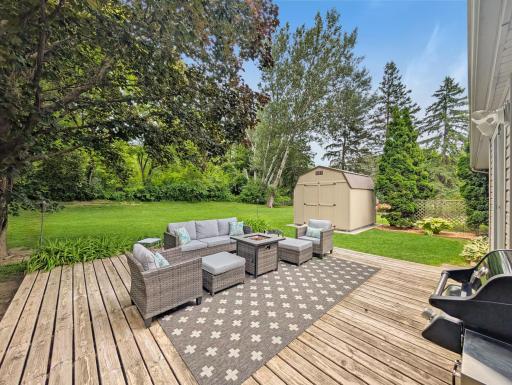 This beautiful deck off the kitchen leads directly into the spacious, beautiful back yard!