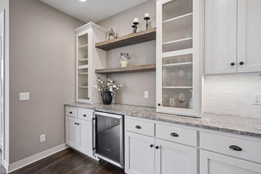Additional cabinet/countertop with wine fridge.