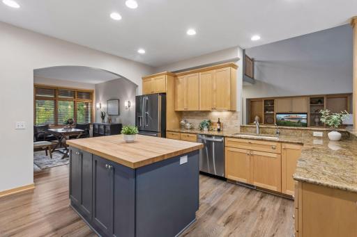 Beautiful kitchen with center island, granite countertops, stainless appliances and open concept.