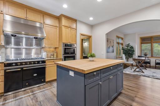 The chef will love the high end gas range, granite tops and butcher block center island.