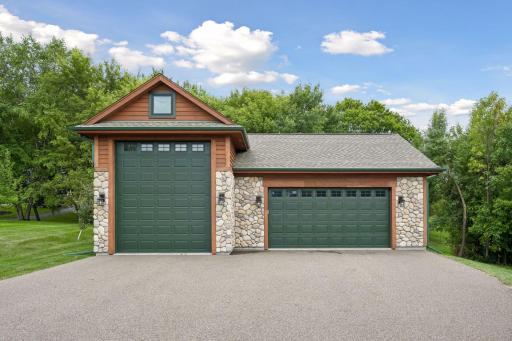 Man Cave DELUXE! This 1200 square foot luxury outbuilding is heated with concrete floors! Perfect set up with a 14' overhead door for the RV, BOAT & TOYS & addtional space for recreation!