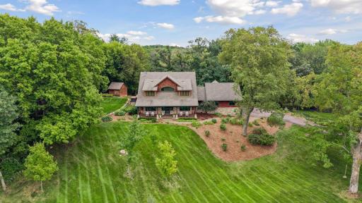 Welcome home to 7780 Erick Street! Beautifully maintained grounds, peaceful wooded views, multiple outdoor spaces and major mechanical updates completed within the past year make this home truly special!