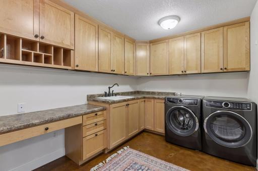 The laundry room is currently located in the lower level but could easily be added to main level mudroom.