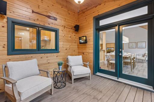 Sun room overlooking private backyard with serene views.