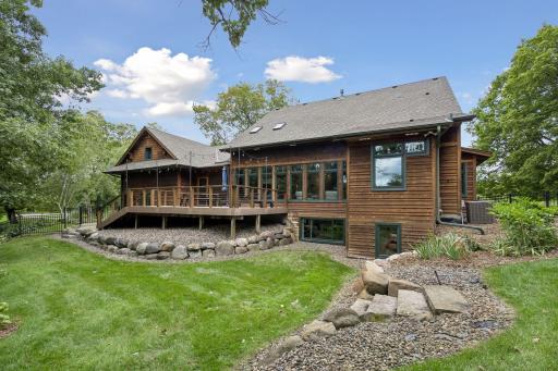 Private oasis outlined in trees, raised garden beds, charming chicken coop and inground sprinkler system.