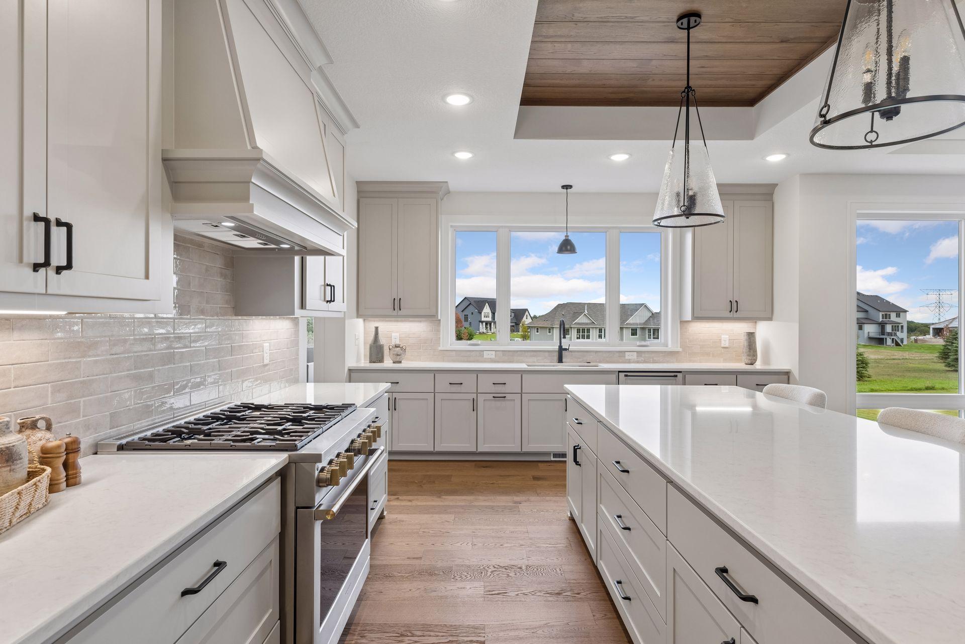 Stainless steel appliances and decorative tile backsplash