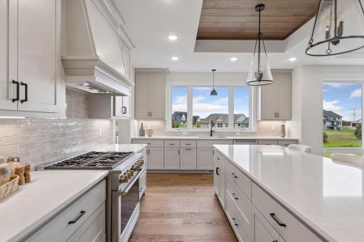 Stainless steel appliances and decorative tile backsplash