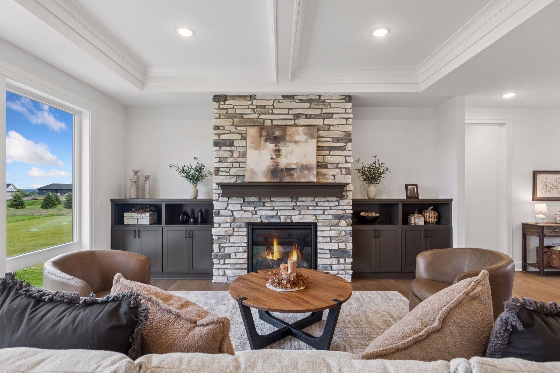 Showstopping stone gas fireplace with built-in cabinetry