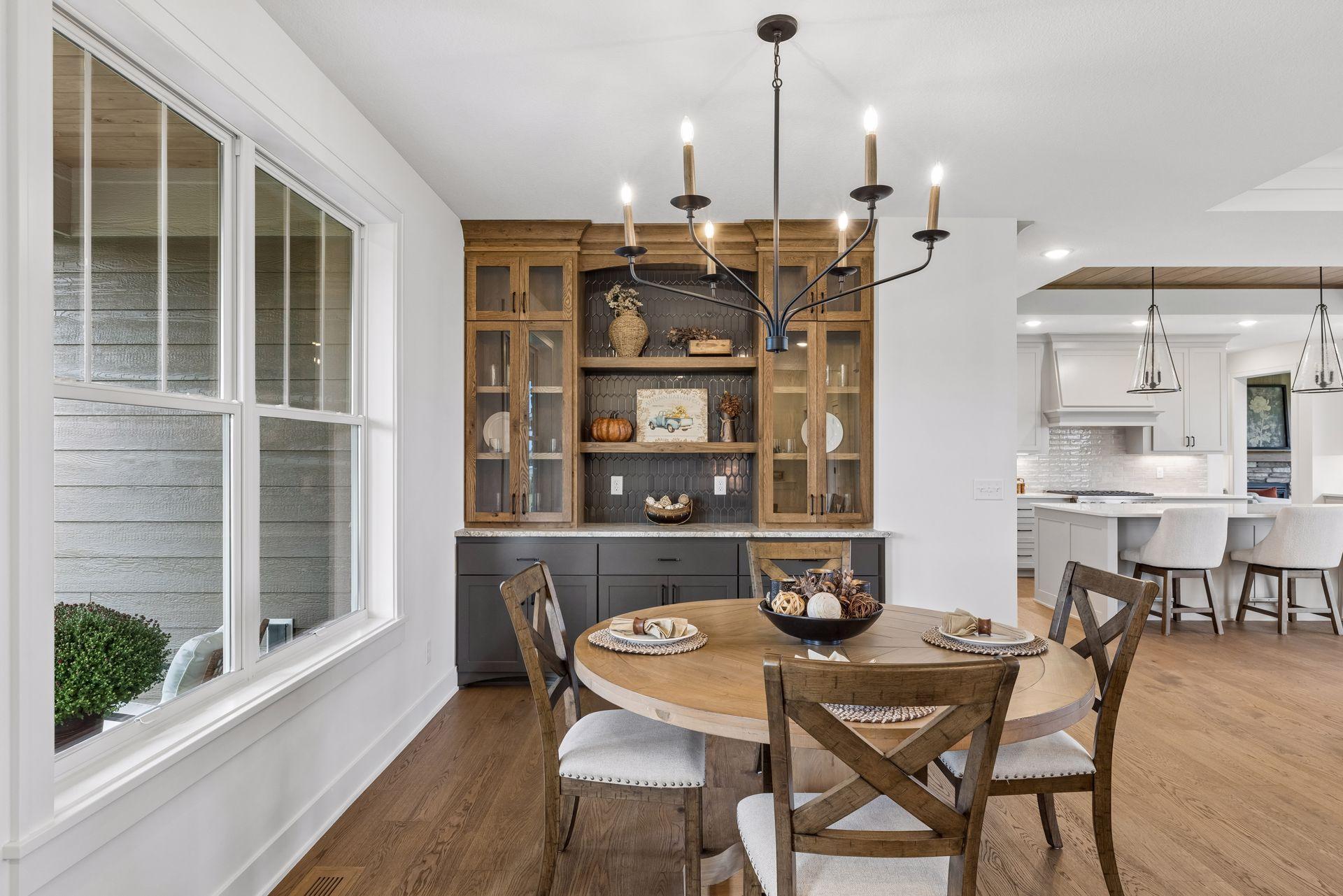 Front informal dining room with stylish built in buffet